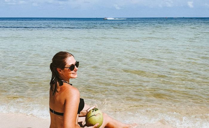 Girl with a coconut on a Phu Quoc beach